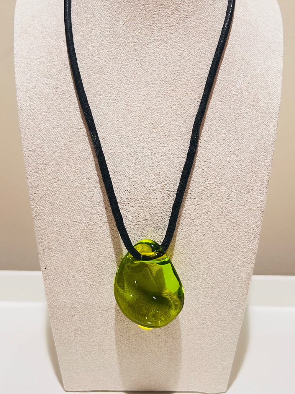 Authentic Baccarat green crystal Galet pebble pendant on a black cord